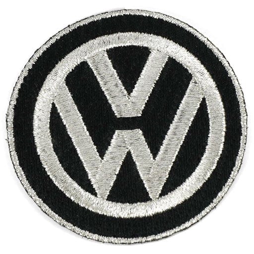 White embroidered patch with repeated instances of the word inexplicable in a variety of colors