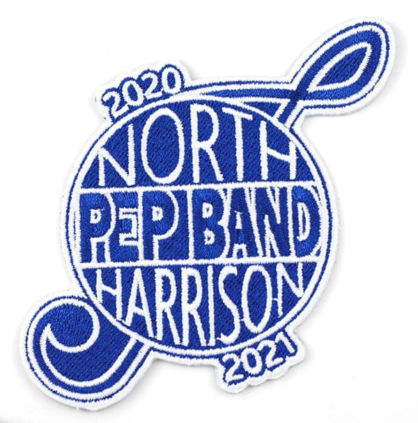 Blue and white embroidered iron-on in the shape of a treble clef with text: North Harrison Pep Band 2020-2021